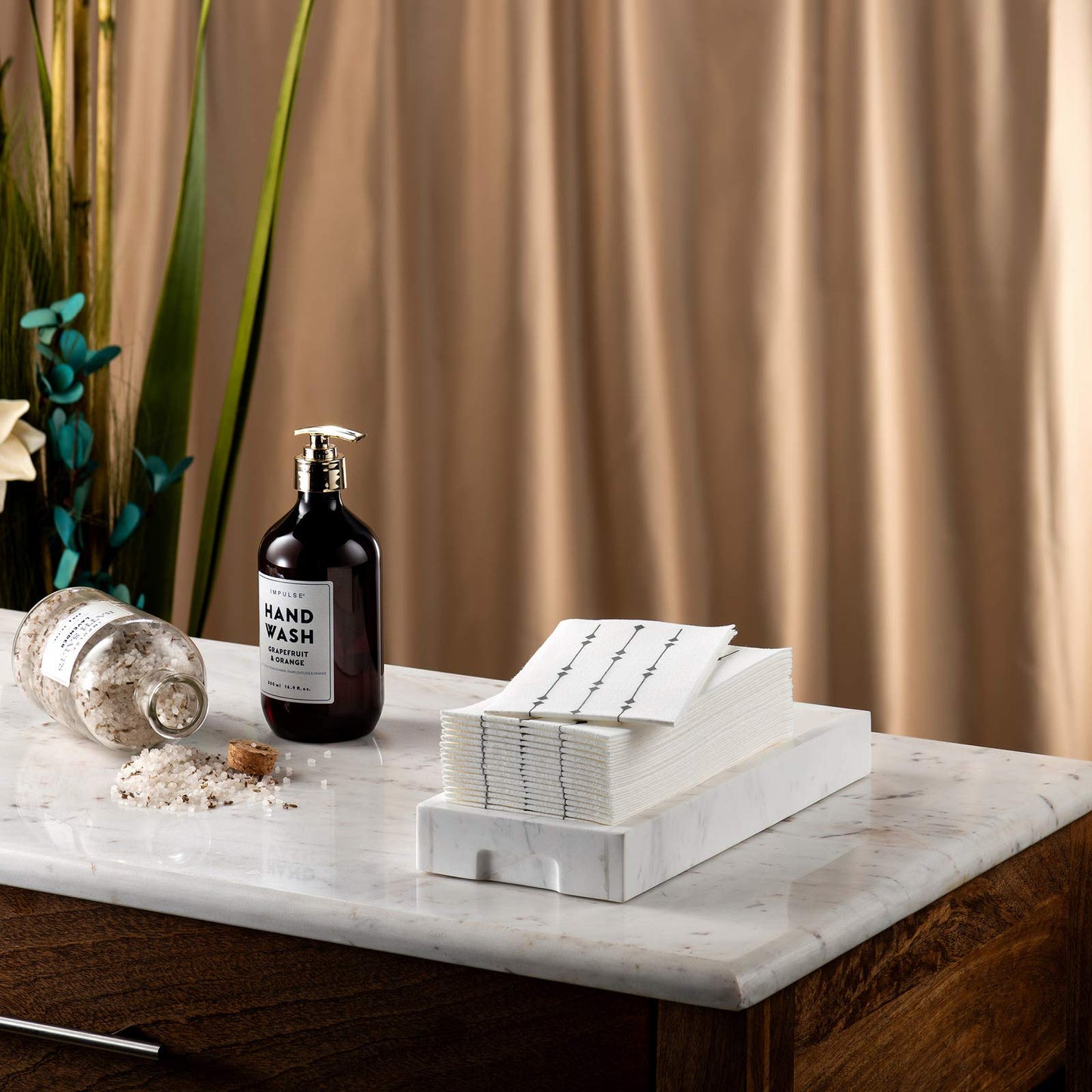 Disposable linen-feel guest towel silver diamond design near bathroom sink