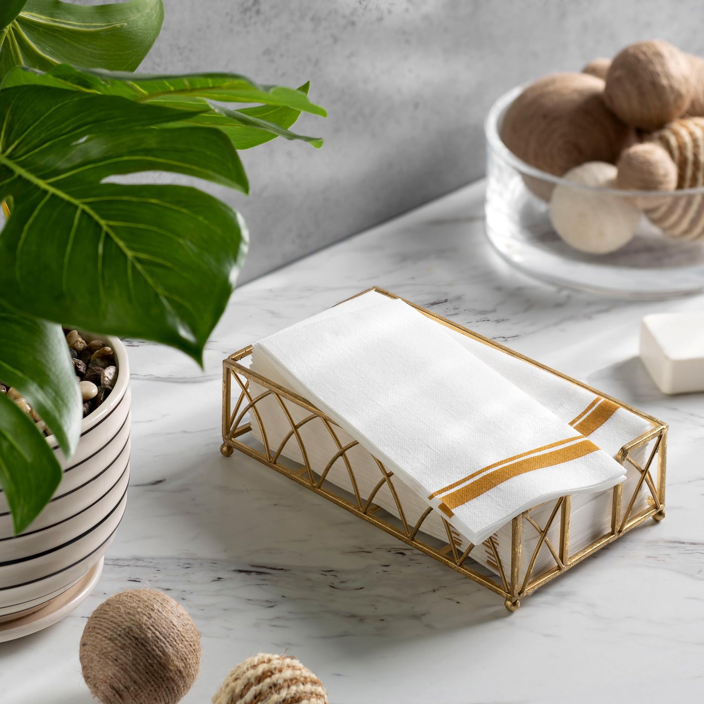 BloominGoods guest towel with gold double-line border in tray