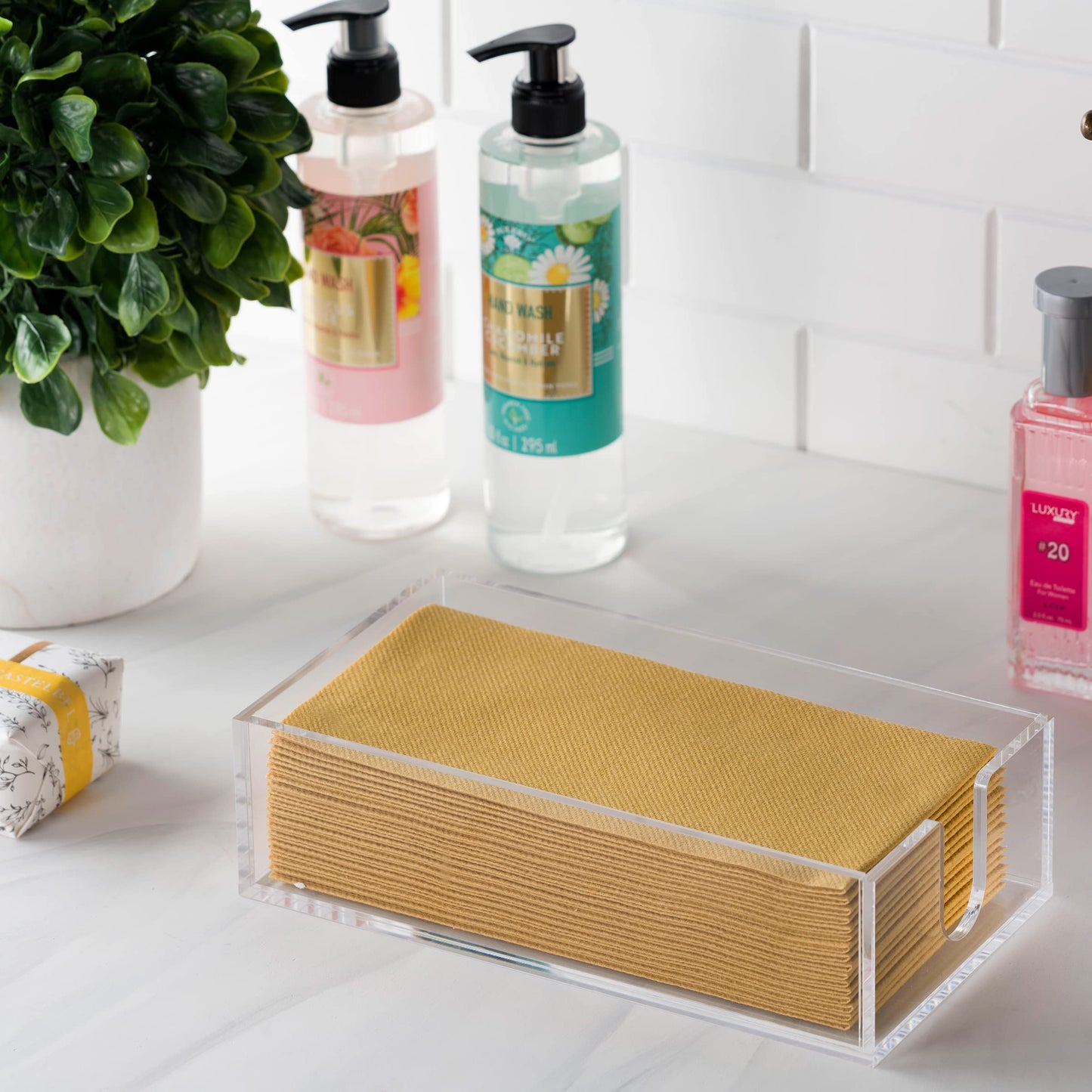 BG-NH-ACR/GT, Side angle of BloominGoods clear tray holding linen-feel napkins in modern bathroom