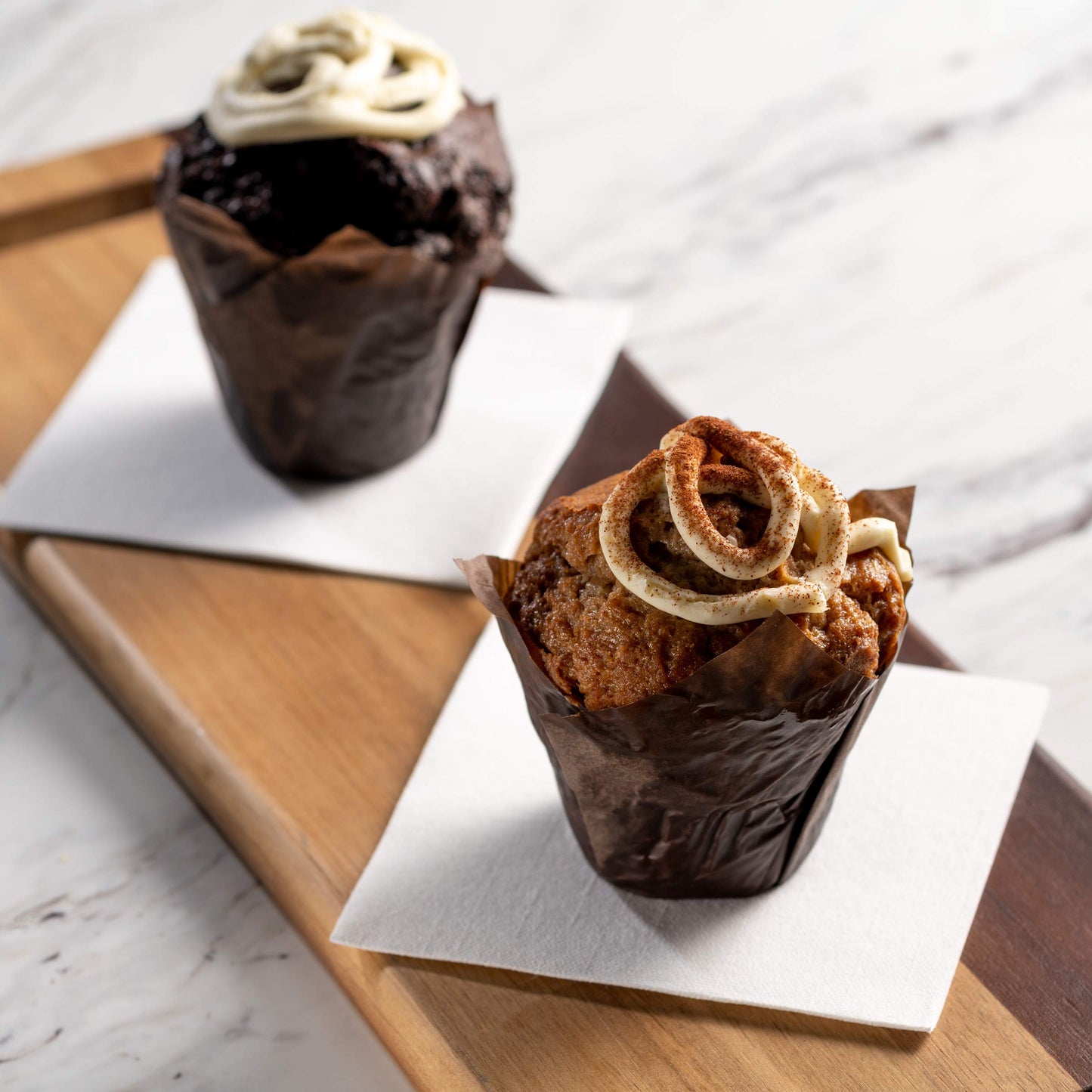 Disposable airlaid napkin under muffin for bakery