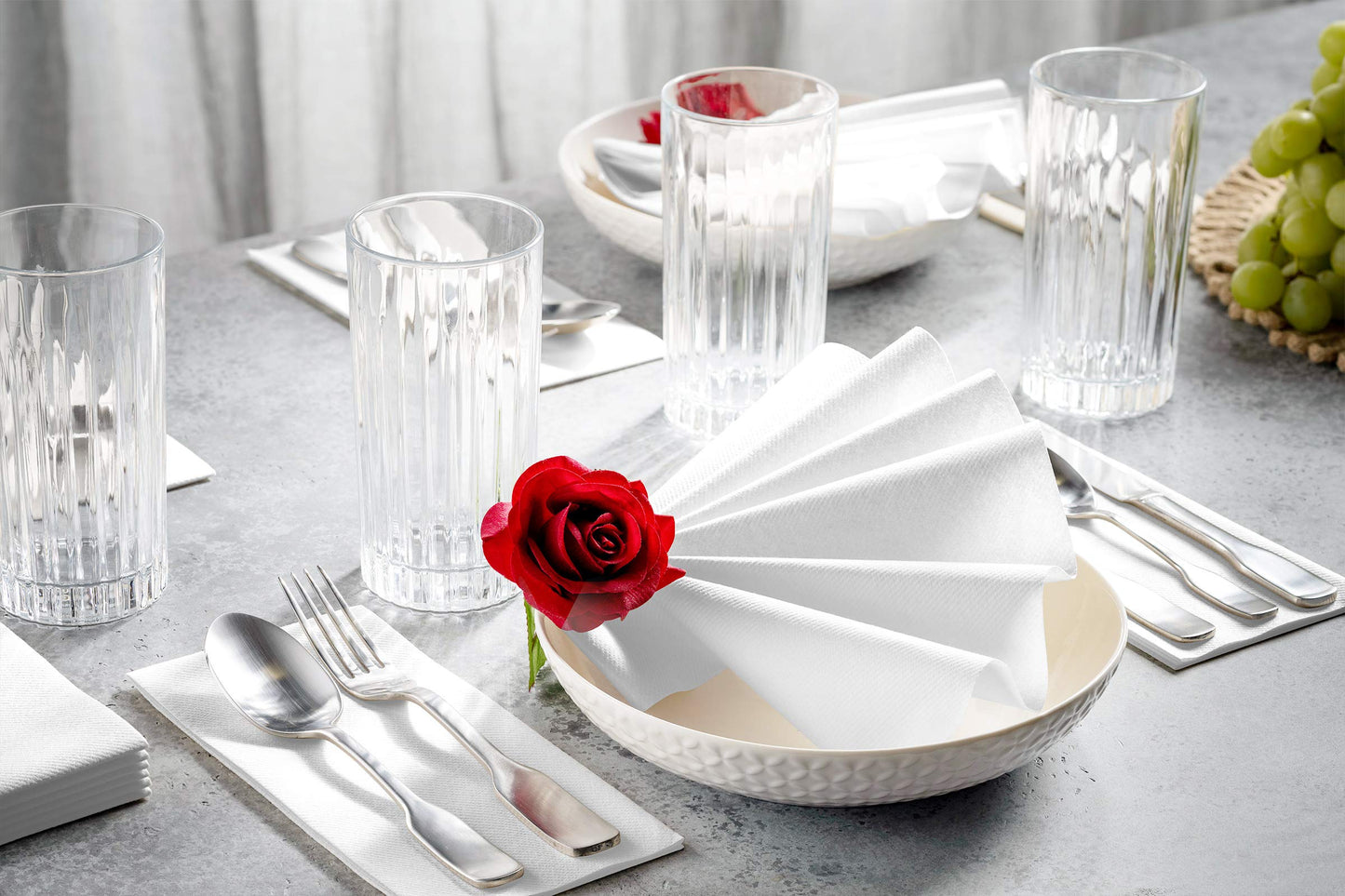 Servietto white guest towel showing soft linen-feel texture inside of a bowl on a formal table