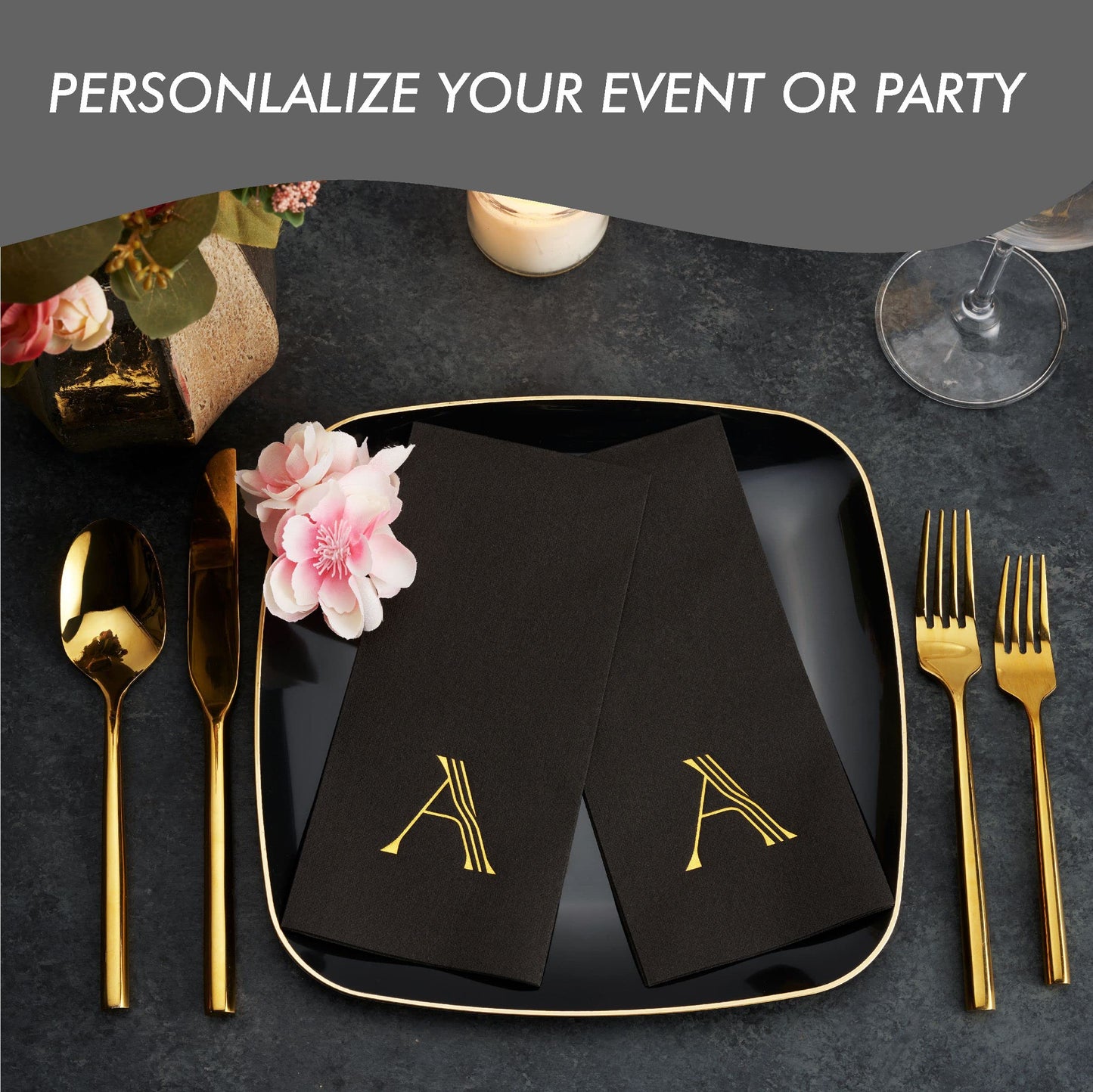 Close-up of gold foil stamped letter monogram on airlaid black napkin