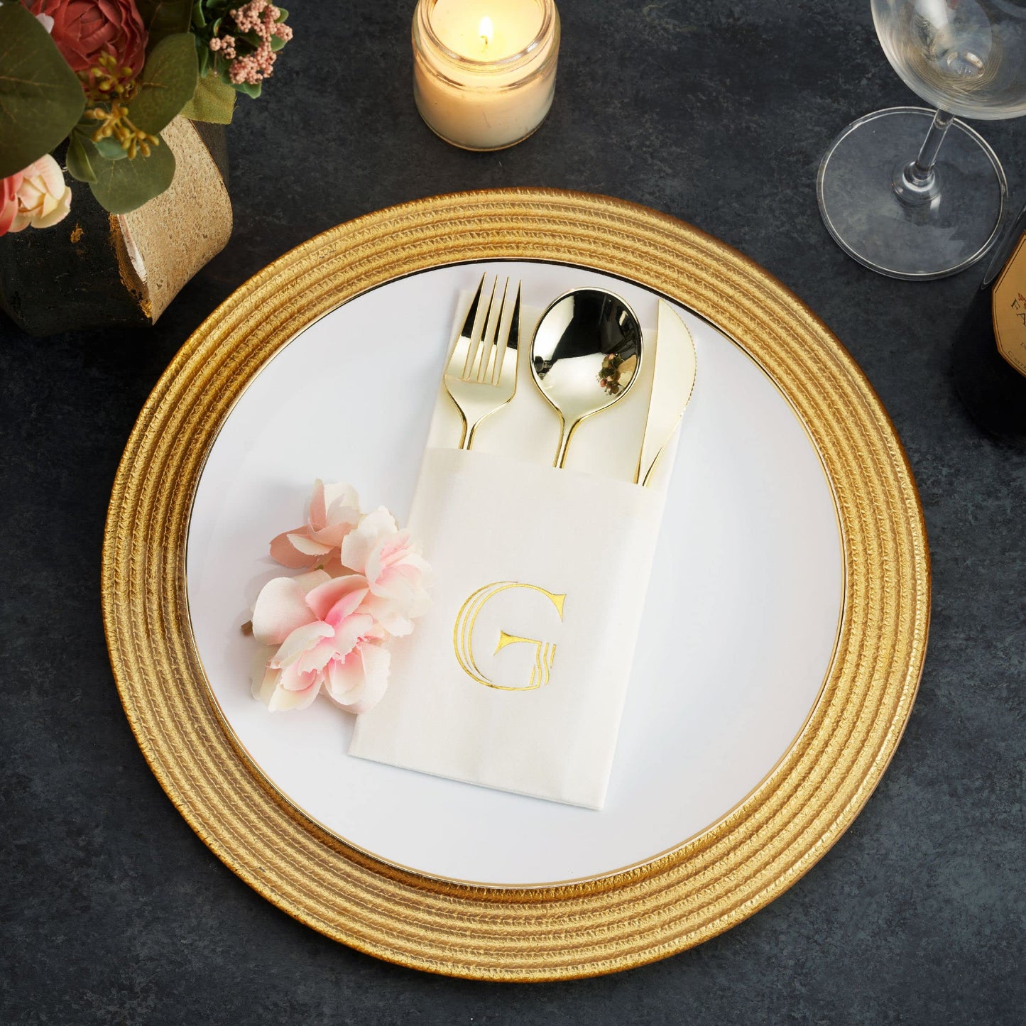 White pocket napkin with gold foil monogram by BloominGoods at formal table setting