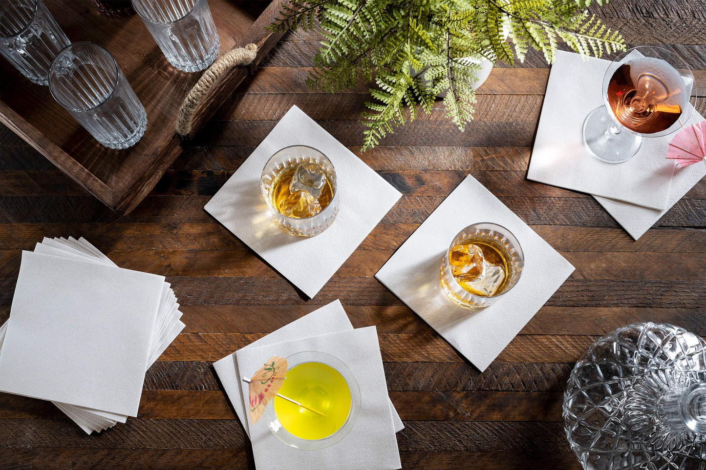 BG-TOLBN-WHT/1000:P, Airlaid paper cocktail napkin protecting surface beneath whiskey tumbler and wine glasses.