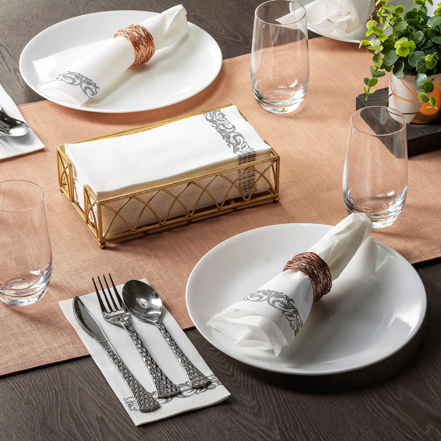 Elegant guest towel with silver floral trim used at formal dining table
