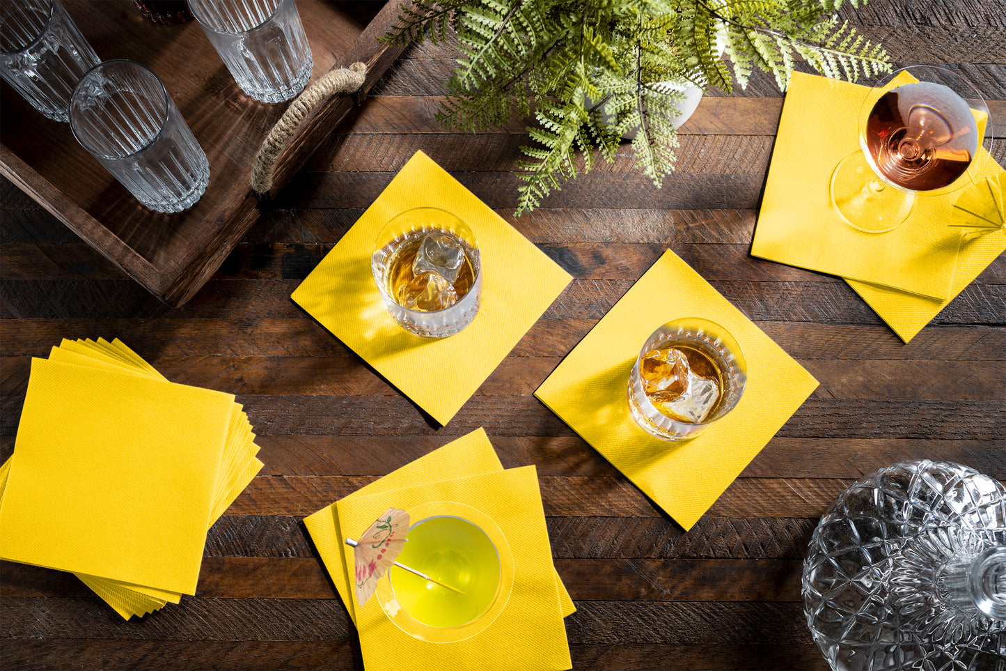 BG-CCN-YLOW/100, disposable yellow linen-feel cocktail napkin underneath cocktails and drinks.