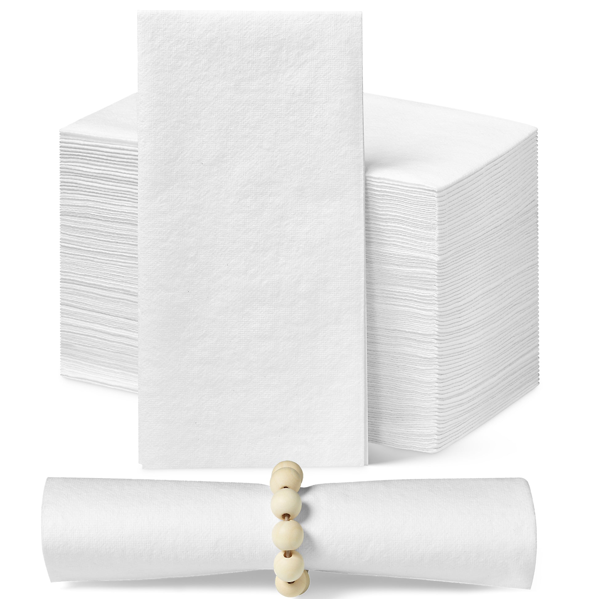 A collection of white disposable dinner napkins. A stack of white napkins is in the background. One napkin stands upright so the face of the napkin can be seen. In the foreground is a rolled up napkin in a beaded napkin ring.